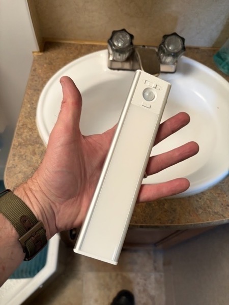 Bathroom light in hand.