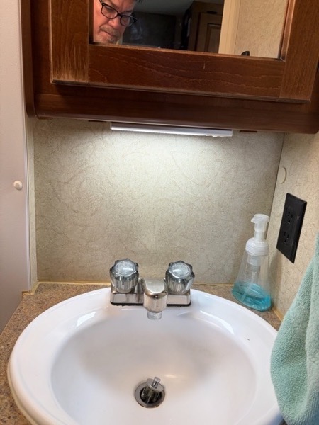 Bathroom light mounted.