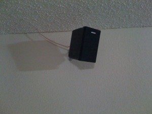Speaker wire drops down from attic and to each individual surround speaker